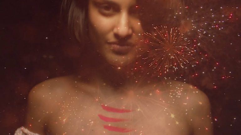 A shot of a girl and fireworks from the Edinburgh's Hogmanay brand film