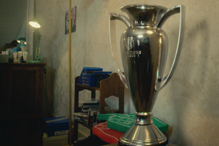 An image of a football trophy in a teenagers bedroom